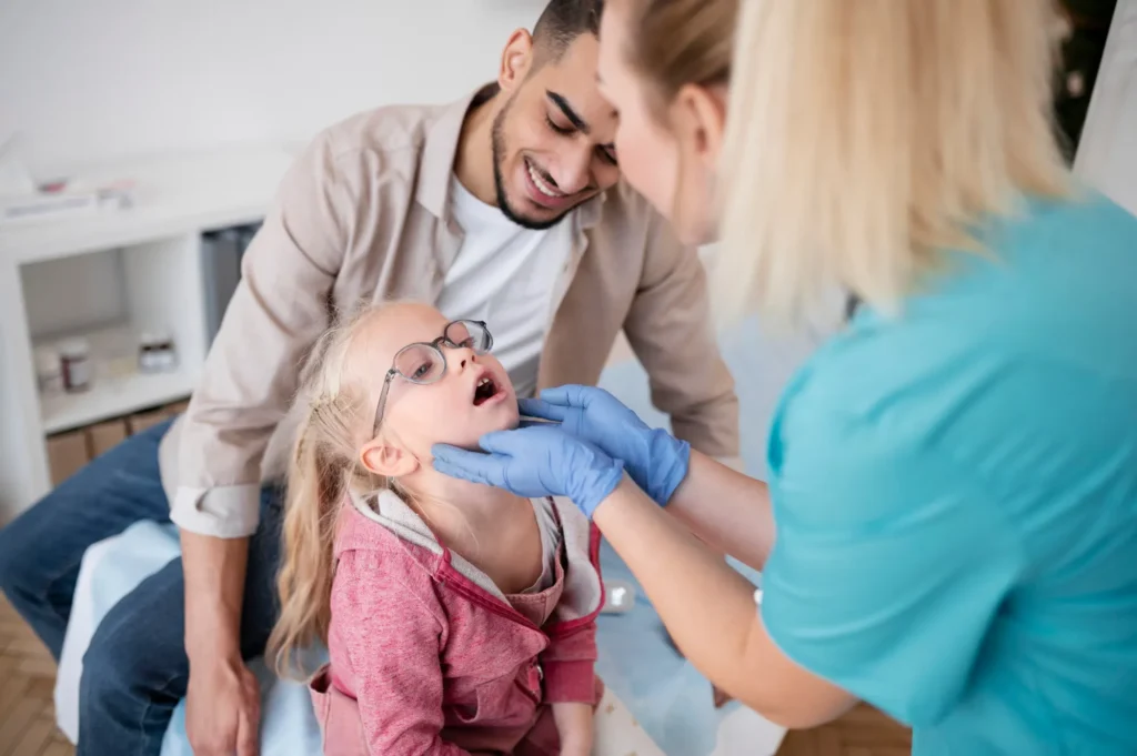 Pediatric dentist discussing treatment options with parents