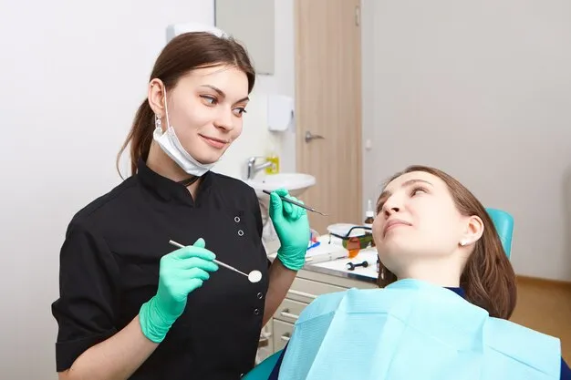 Pediatric dentist examining child's teeth and gums