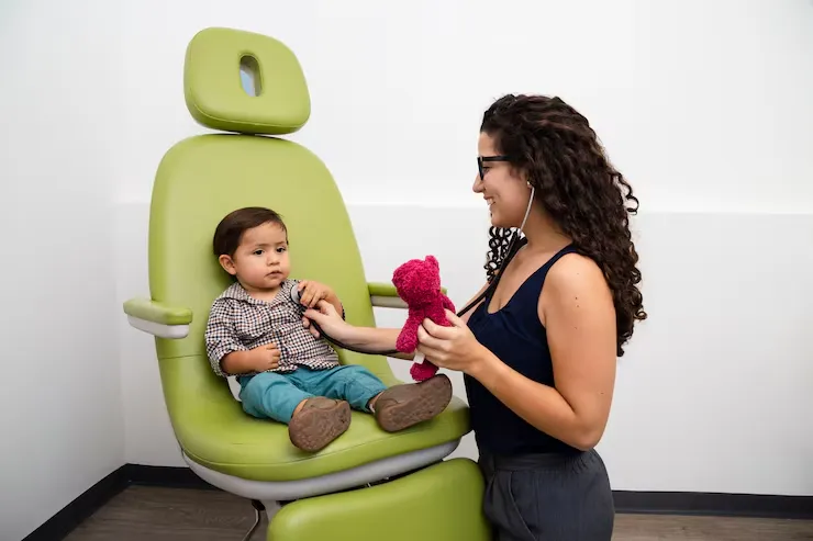 parent comforting child calm dental clinic scene