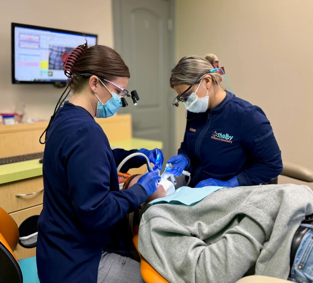 Dental_care01 Restorative pediatric dentistry treatment for a child receiving a dental filling at Shelby Pediatric Dentistry in Pelham, AL